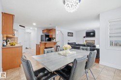 Open-concept living space with a dining area, kitchen, and living room - 