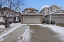 Front exterior featuring brick veneer accents, an attached garage, and a concrete driveway - 3016 24 Ave Nw, Edmonton, AB  - Outdoor With Facade 