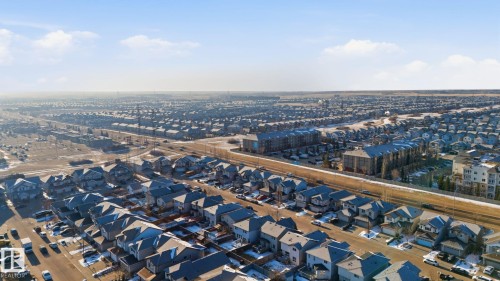 Residential neighborhood featuring detached homes, multi-story residential buildings, and paved roads - 3016 24 Ave Nw, Edmonton, AB - Outdoor With View