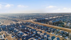 Residential neighborhood featuring detached homes, multi-story residential buildings, and paved roads - 