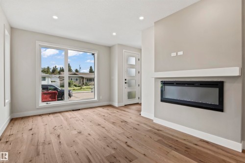 5606 105 Avenue Nw, Edmonton, AB - Indoor Photo Showing Living Room With Fireplace