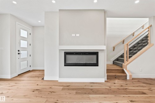 5606 105 Avenue Nw, Edmonton, AB - Indoor Photo Showing Living Room With Fireplace