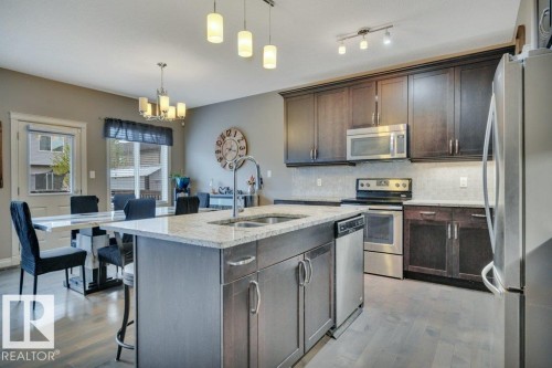 155 Kirpatrick Crescent, Leduc, AB - Indoor Photo Showing Kitchen With Double Sink With Upgraded Kitchen