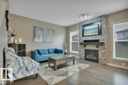 155 Kirpatrick Crescent, Leduc, AB - Indoor Photo Showing Living Room With Fireplace