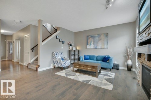 155 Kirpatrick Crescent, Leduc, AB - Indoor Photo Showing Living Room With Fireplace
