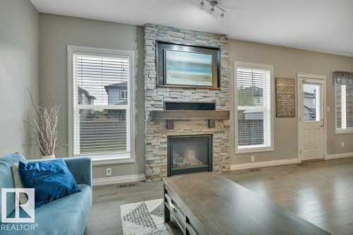 155 Kirpatrick Crescent, Leduc, AB - Indoor Photo Showing Living Room With Fireplace