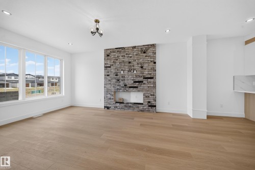 508 Robinson Boulevard, Leduc, AB - Indoor Photo Showing Other Room With Fireplace