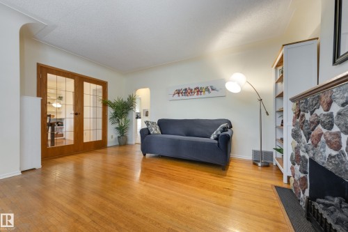 10644 65 Avenue Nw, Edmonton, AB - Indoor Photo Showing Living Room With Fireplace
