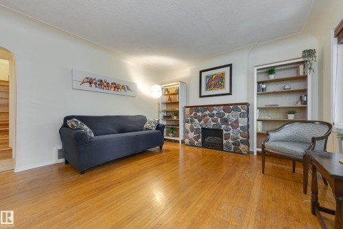 10644 65 Avenue Nw, Edmonton, AB - Indoor Photo Showing Living Room With Fireplace