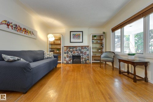 10644 65 Avenue Nw, Edmonton, AB - Indoor Photo Showing Living Room With Fireplace