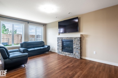 2312 Casey Cres Sw, Edmonton, AB - Indoor Photo Showing Living Room With Fireplace