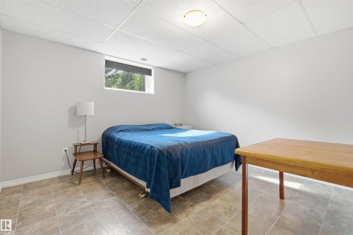 Room with neutral wall paint and a drop ceiling - 59125 Range Road 102, Rural St. Paul County, AB - Indoor Photo Showing Bedroom