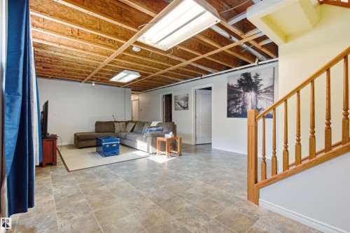 Spacious mostly finished family room with rough in for wet bar - 59125 Range Road 102, Rural St. Paul County, AB - Indoor Photo Showing Other Room