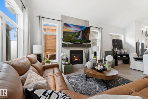 55 Maple Crescent, Gibbons, AB - Indoor Photo Showing Living Room With Fireplace