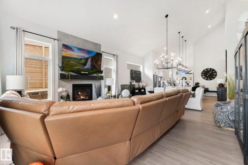 55 Maple Crescent, Gibbons, AB - Indoor Photo Showing Living Room With Fireplace