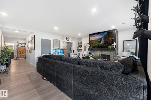 55 Maple Crescent, Gibbons, AB - Indoor Photo Showing Living Room With Fireplace