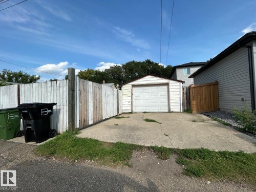 Detached garage with white overhead door - 11934 64 Street Nw, Edmonton, AB - Outdoor With Exterior