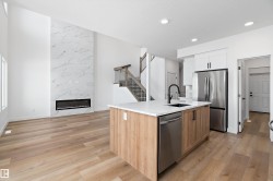 Soaring ceiling with a full-height marble-look fireplace - 
