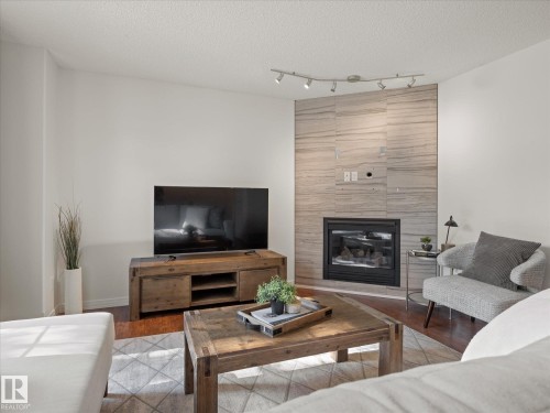 1502 Grant Way Nw, Edmonton, AB - Indoor Photo Showing Living Room With Fireplace
