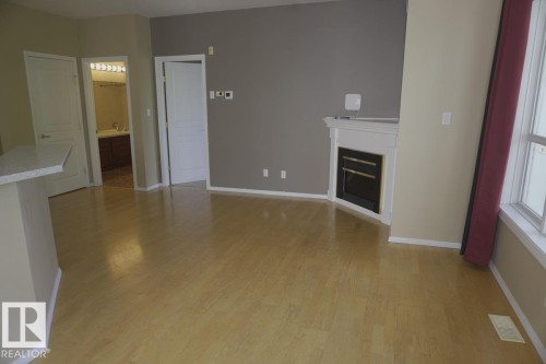 #434 10023 110 St Nw, Edmonton, AB - Indoor Photo Showing Other Room With Fireplace