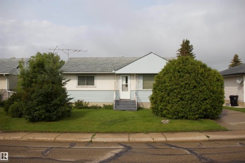 Single-story residence featuring a gray shingled roof and light blue siding accents - 4946 47 Street, Barrhead, AB - Outdoor