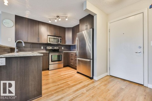 #411 2204 44 Av Nw, Edmonton, AB - Indoor Photo Showing Kitchen With Stainless Steel Kitchen