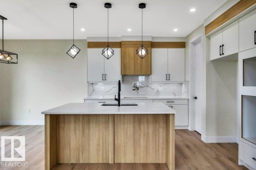 409 Robinson Boulevard, Leduc, AB - Indoor Photo Showing Kitchen With Upgraded Kitchen