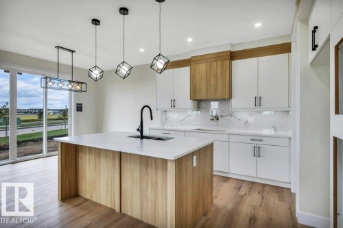 409 Robinson Boulevard, Leduc, AB - Indoor Photo Showing Kitchen With Upgraded Kitchen
