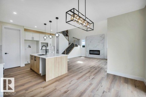 409 Robinson Boulevard, Leduc, AB - Indoor Photo Showing Other Room With Fireplace