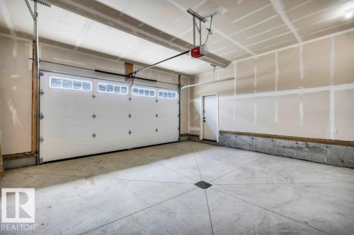 409 Robinson Boulevard, Leduc, AB - Indoor Photo Showing Garage