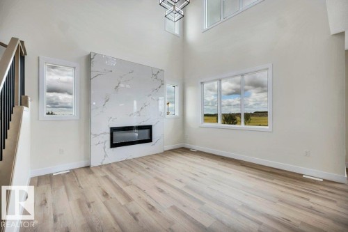 409 Robinson Boulevard, Leduc, AB - Indoor Photo Showing Other Room With Fireplace