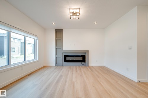 10 Blackbird Bend, Fort Saskatchewan, AB - Indoor Photo Showing Living Room With Fireplace