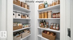 Built-in white shelving system with multiple storage levels - 