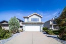 Two-story residence featuring light-colored siding and a contrasting roof - 7848 7 Avenue Sw, Edmonton, AB 