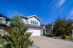 Light blue siding exterior with white trim - 
