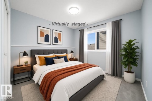 Recessed window with drapes, wall-to-wall carpeting, and a flush mount ceiling light - 7848 7 Avenue Sw, Edmonton, AB 