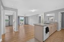 #236 592 Hooke Rd Nw, Edmonton, AB  - Indoor Photo Showing Kitchen With Double Sink 