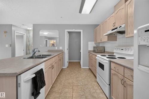 #236 592 Hooke Rd Nw, Edmonton, AB - Indoor Photo Showing Kitchen With Double Sink