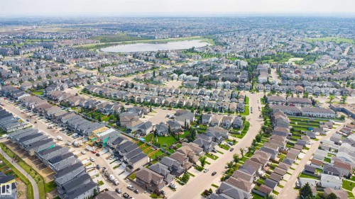 Expansive residential area with a prominent body of water, extensive green spaces, and a network of paved streets - 8815 181 Avenue Nw, Edmonton, AB - Outdoor With View
