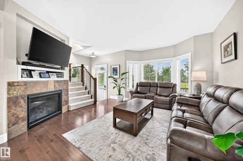 301 Sheridan Way, Leduc, AB - Indoor Photo Showing Living Room With Fireplace