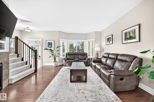 301 Sheridan Way, Leduc, AB - Indoor Photo Showing Living Room With Fireplace