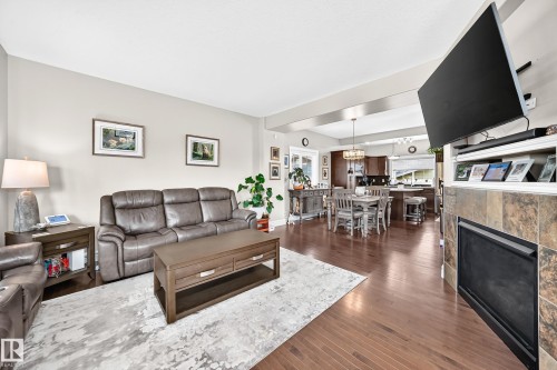 301 Sheridan Way, Leduc, AB - Indoor Photo Showing Living Room With Fireplace
