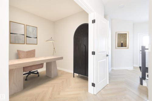 Herringbone wood-finish flooring extends throughout the space - 24 Clichy Close, St. Albert, AB - Indoor