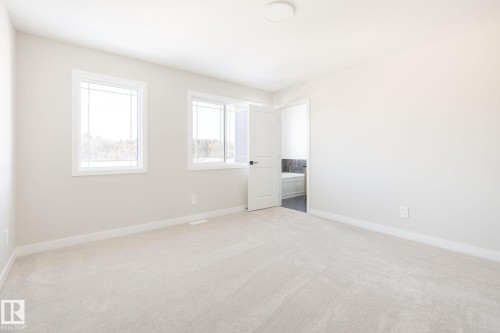 Soft-toned wall paint and carpeted flooring - 24 Clichy Close, St. Albert, AB - Indoor Photo Showing Other Room
