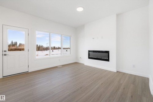 4178 Kinglet Drive Nw, Edmonton, AB - Indoor Photo Showing Living Room With Fireplace