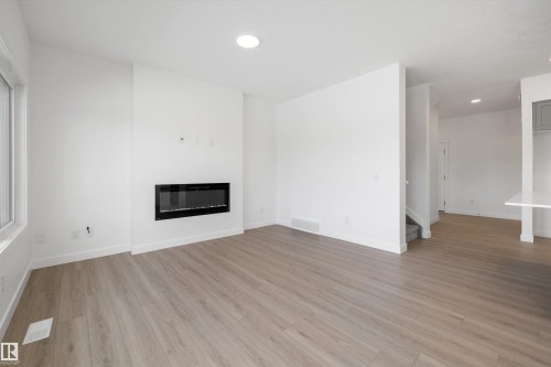 4178 Kinglet Drive Nw, Edmonton, AB - Indoor Photo Showing Living Room With Fireplace