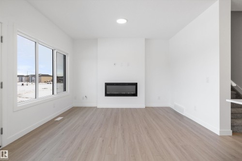 4178 Kinglet Drive Nw, Edmonton, AB - Indoor Photo Showing Other Room With Fireplace