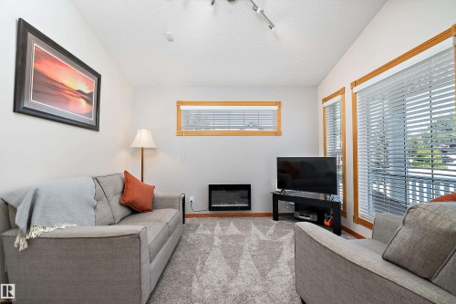 1 Linksview Cl, Spruce Grove, AB - Indoor Photo Showing Living Room With Fireplace