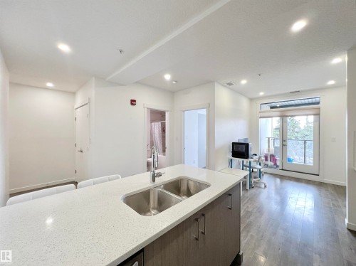 #310 11503 76 Av Nw, Edmonton, AB - Indoor Photo Showing Kitchen With Double Sink