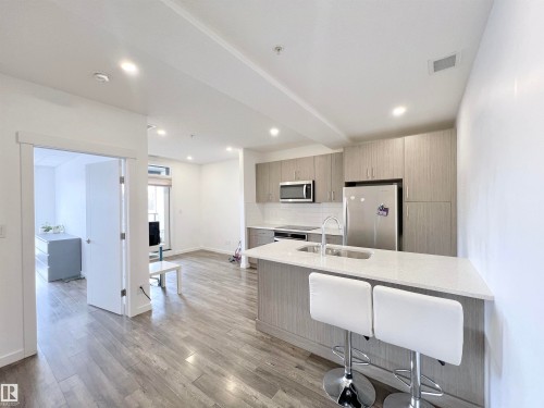 #310 11503 76 Av Nw, Edmonton, AB - Indoor Photo Showing Kitchen With Double Sink